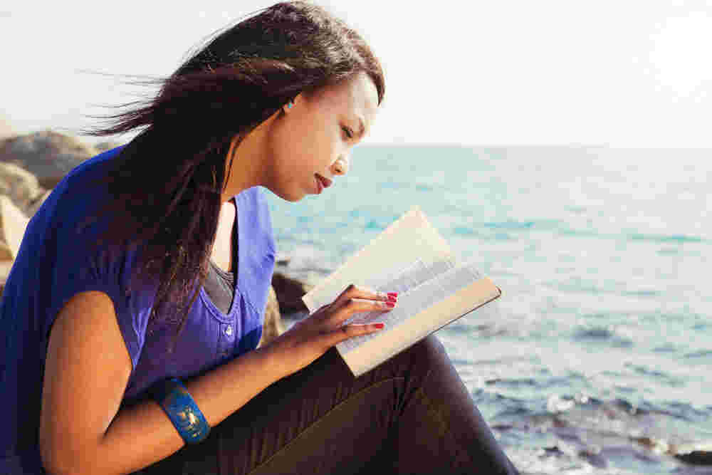 A young woman reading the bible.